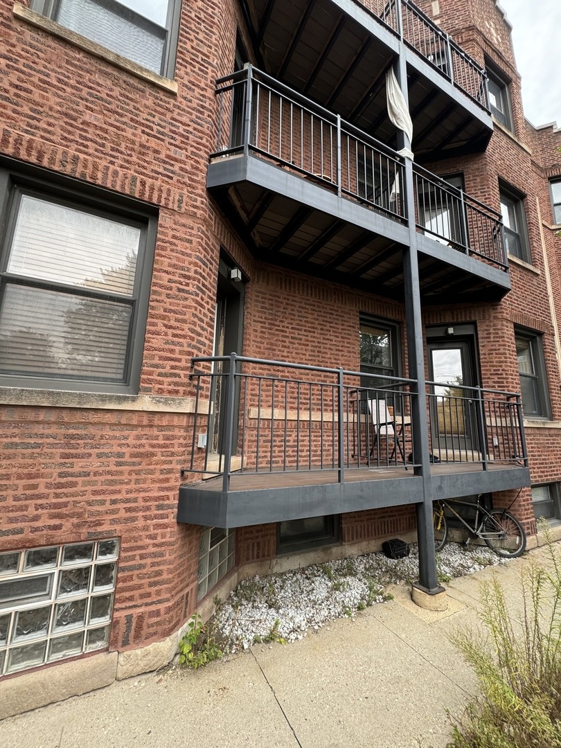 a view of a house with wooden deck