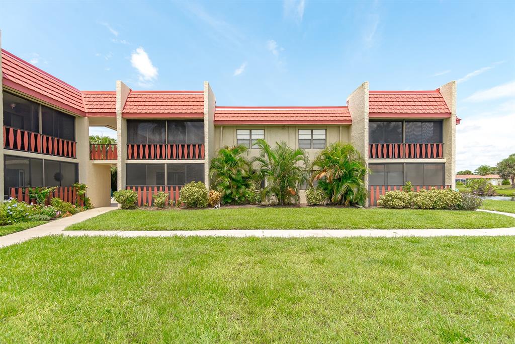 a view of a front of a house with a yard