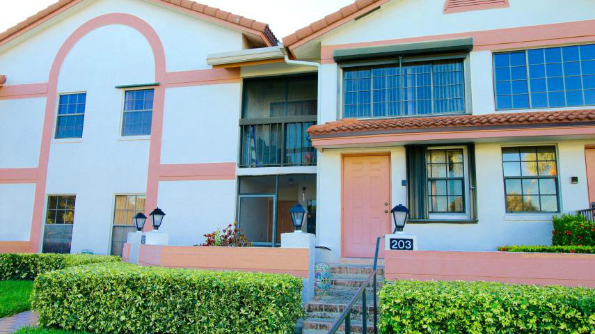 a front view of a house having yard