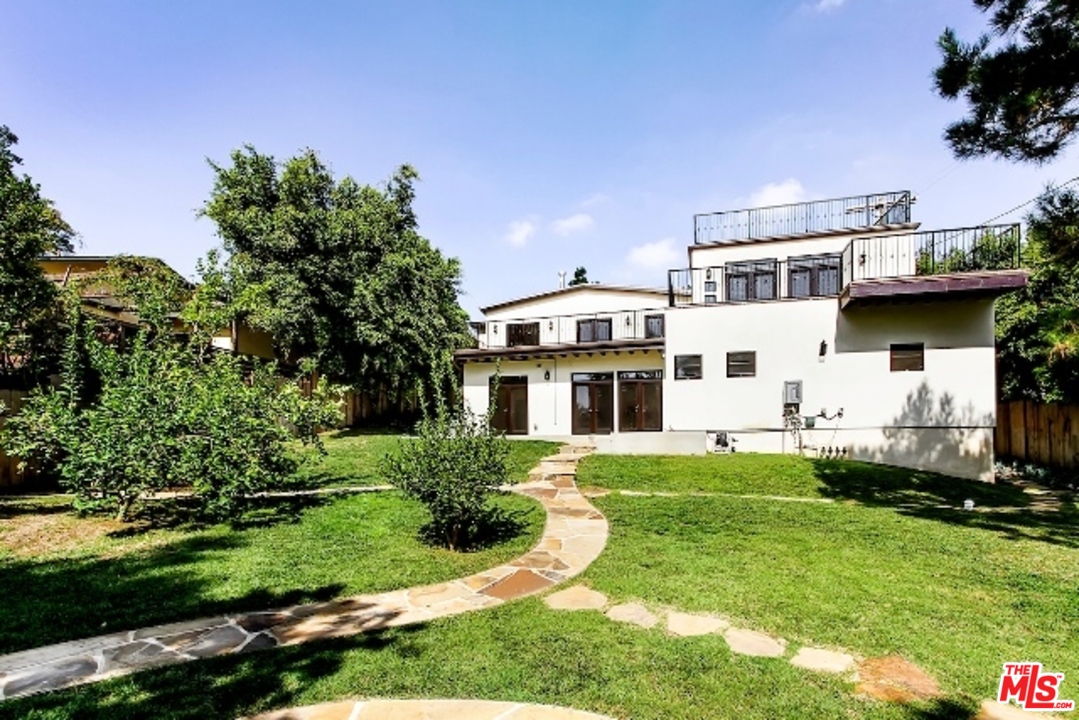 a house view with a garden space