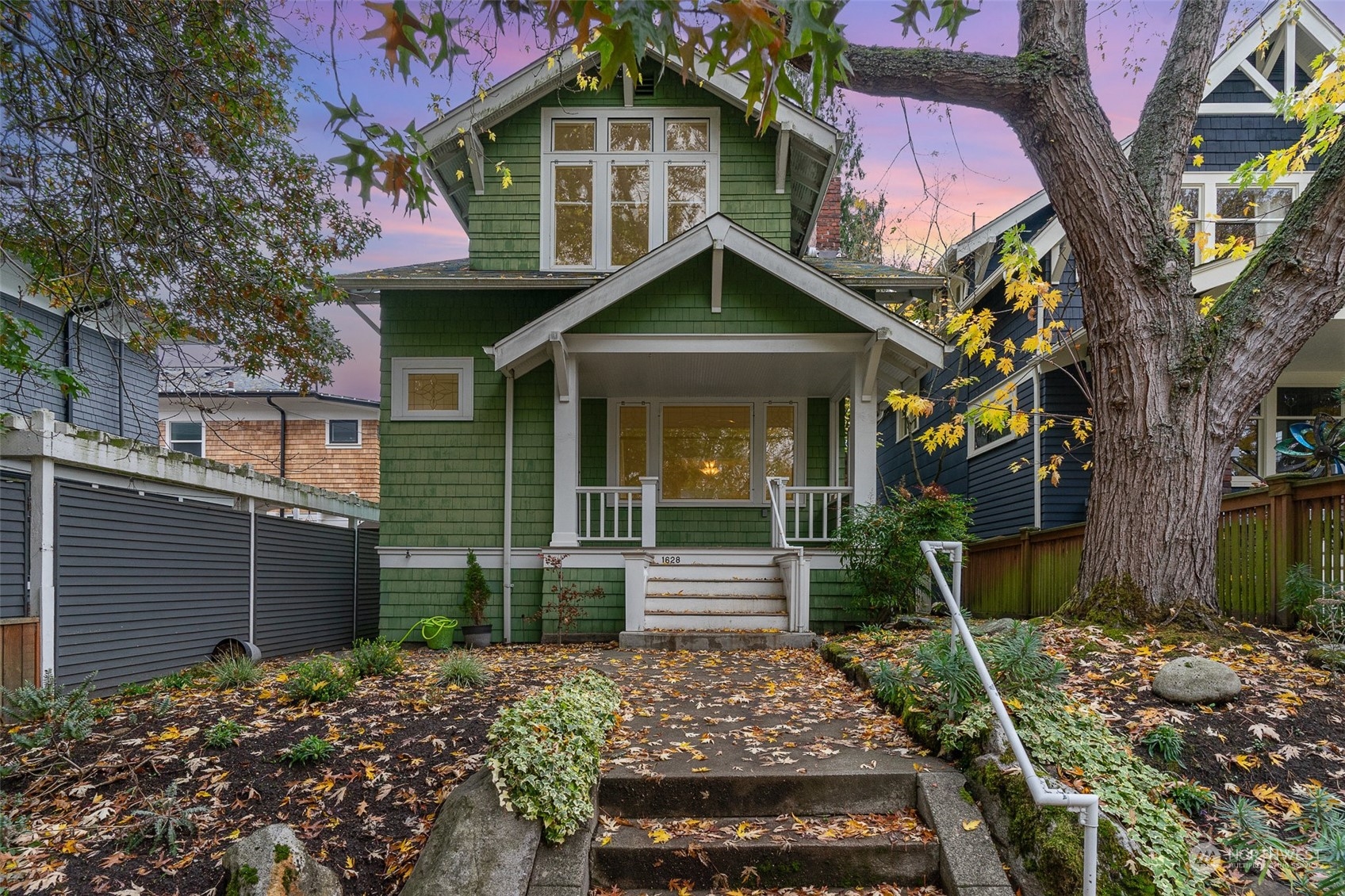 a front view of a house with garden