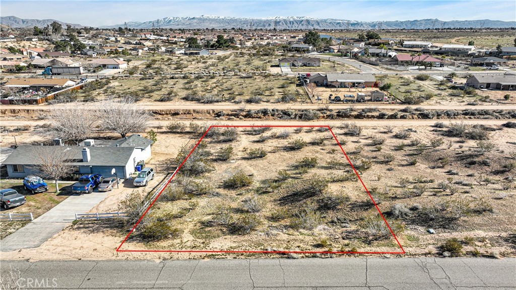 an aerial view of residential houses with parking space