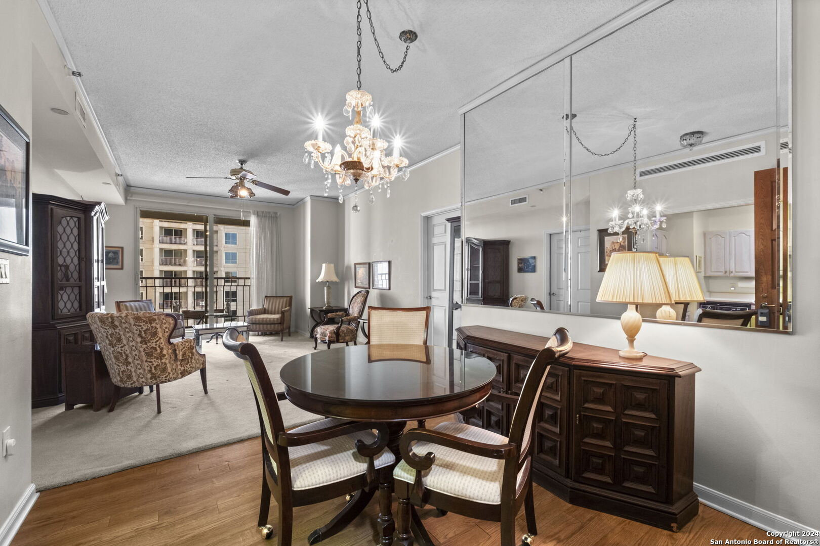 a view of a dining room with furniture window and wooden floor