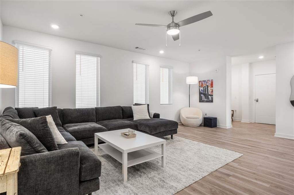 a living room with furniture and a window