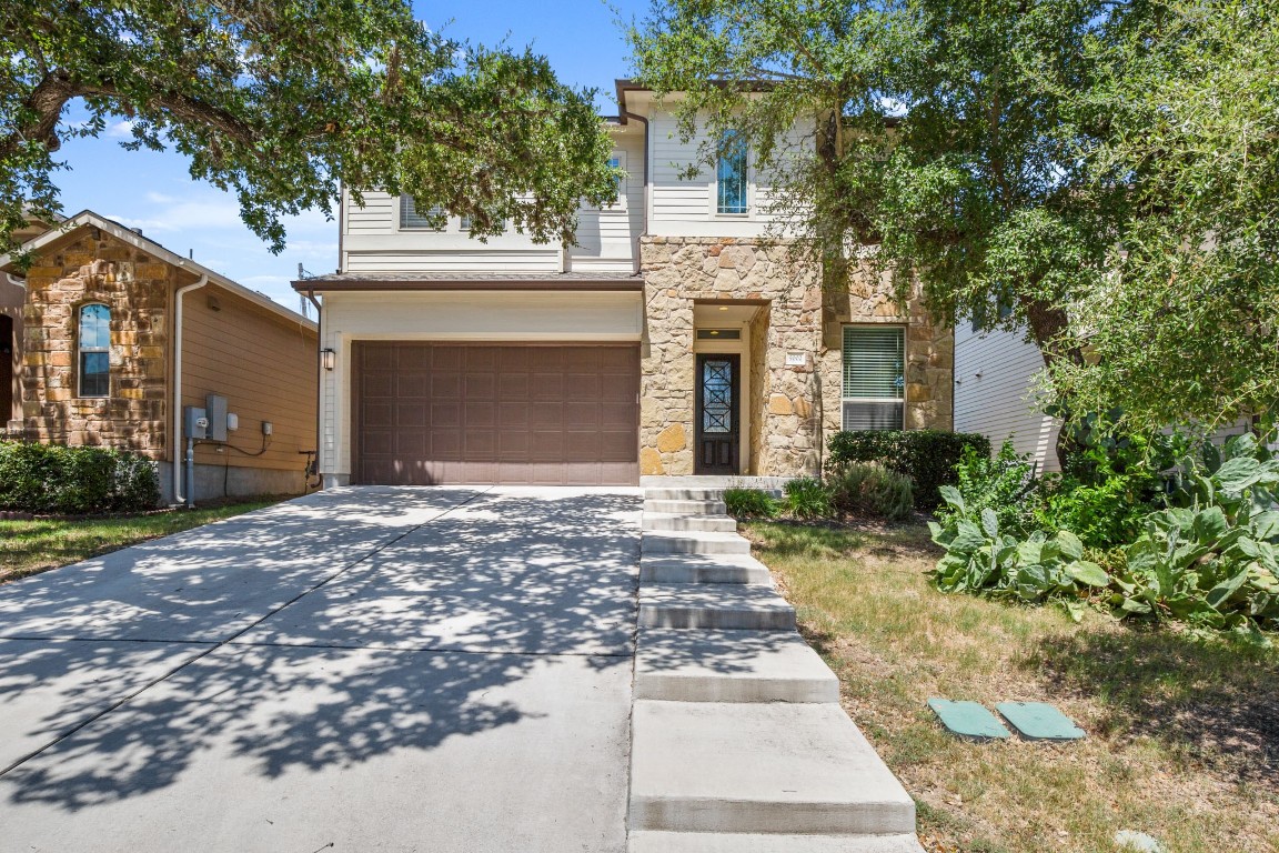 a view of a yard and front view of a house