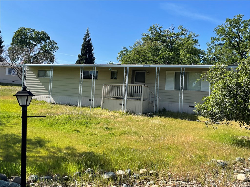 a view of house with yard