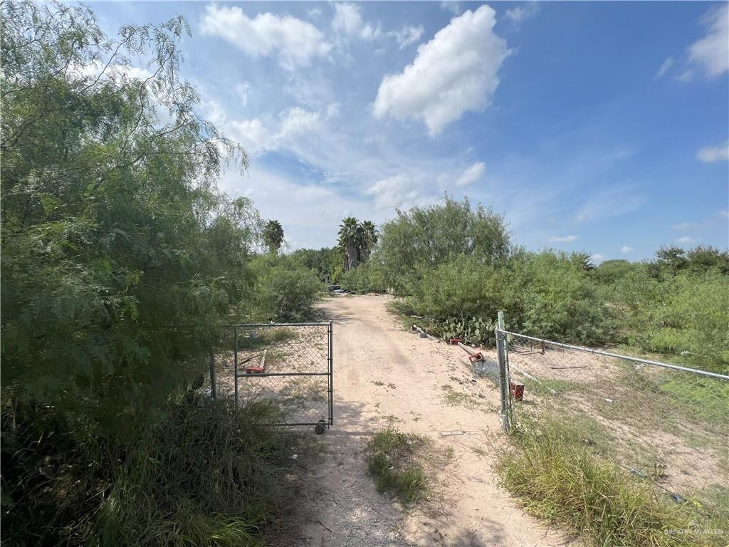 a view of a road with a yard