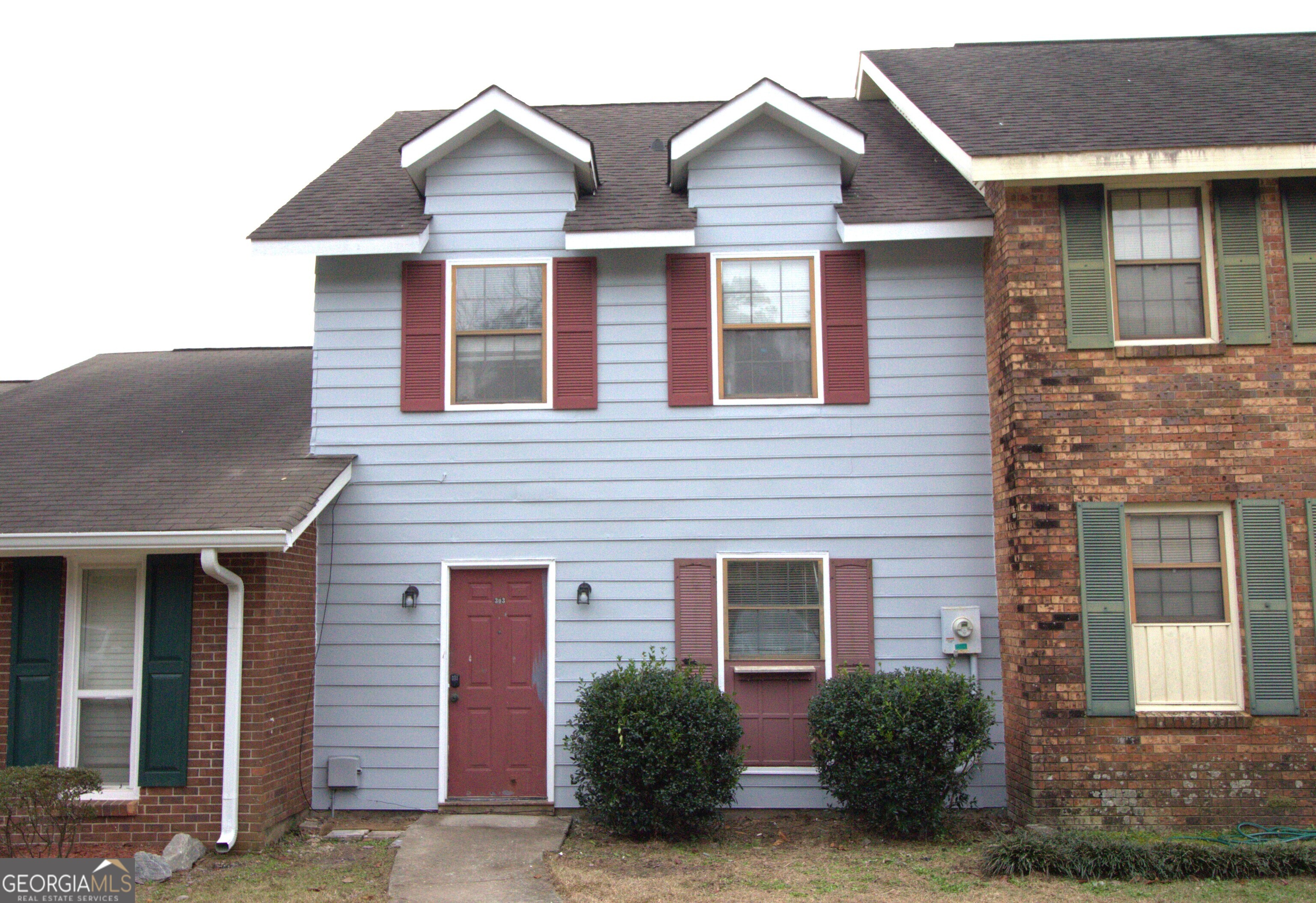 a front view of a house with garage