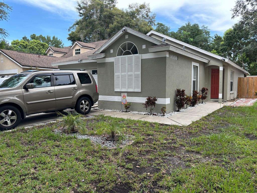 a view of a house that has a car park