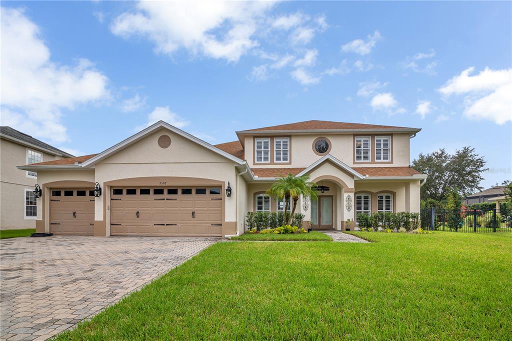 a front view of a house with a yard