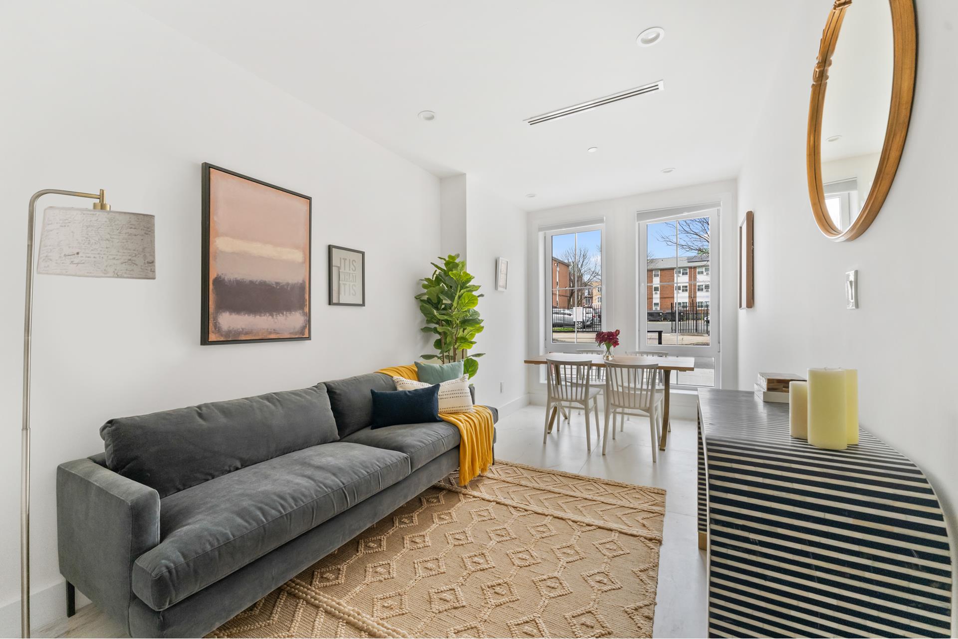 a living room with furniture and a table