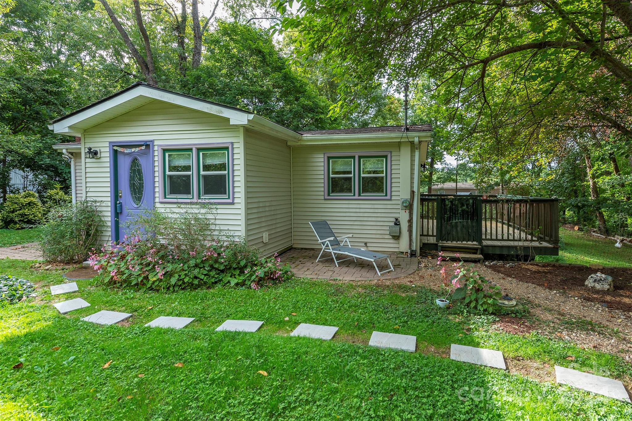 a backyard of a house with seating space