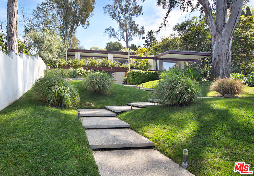 a view of backyard with green space