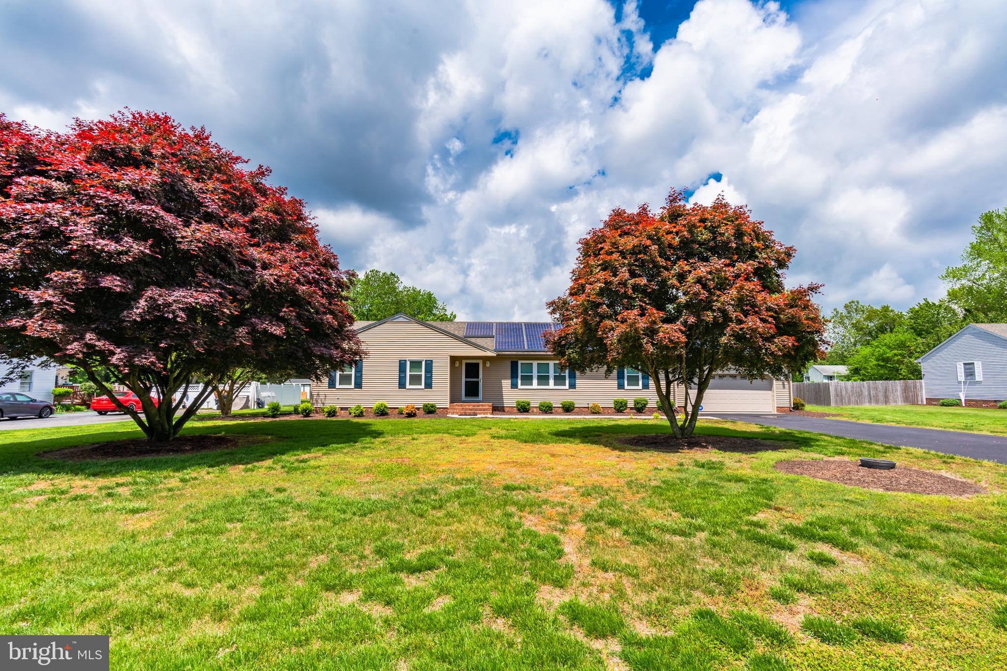 a view of yard with swimming pool and green space