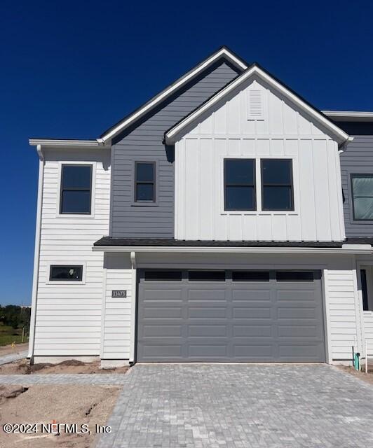 a front view of a house with a garage