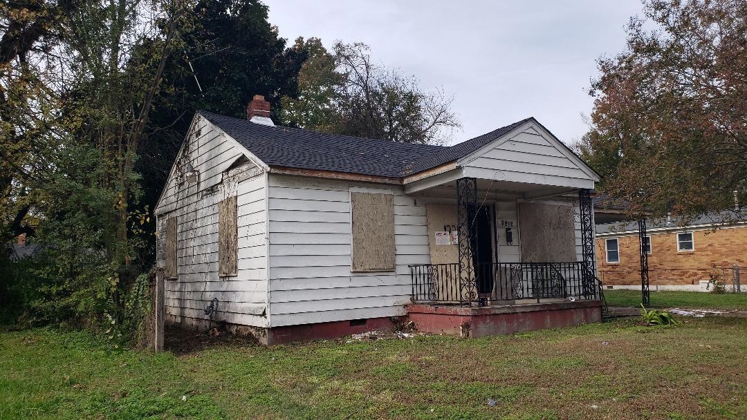 Bungalow-style home with a front yard