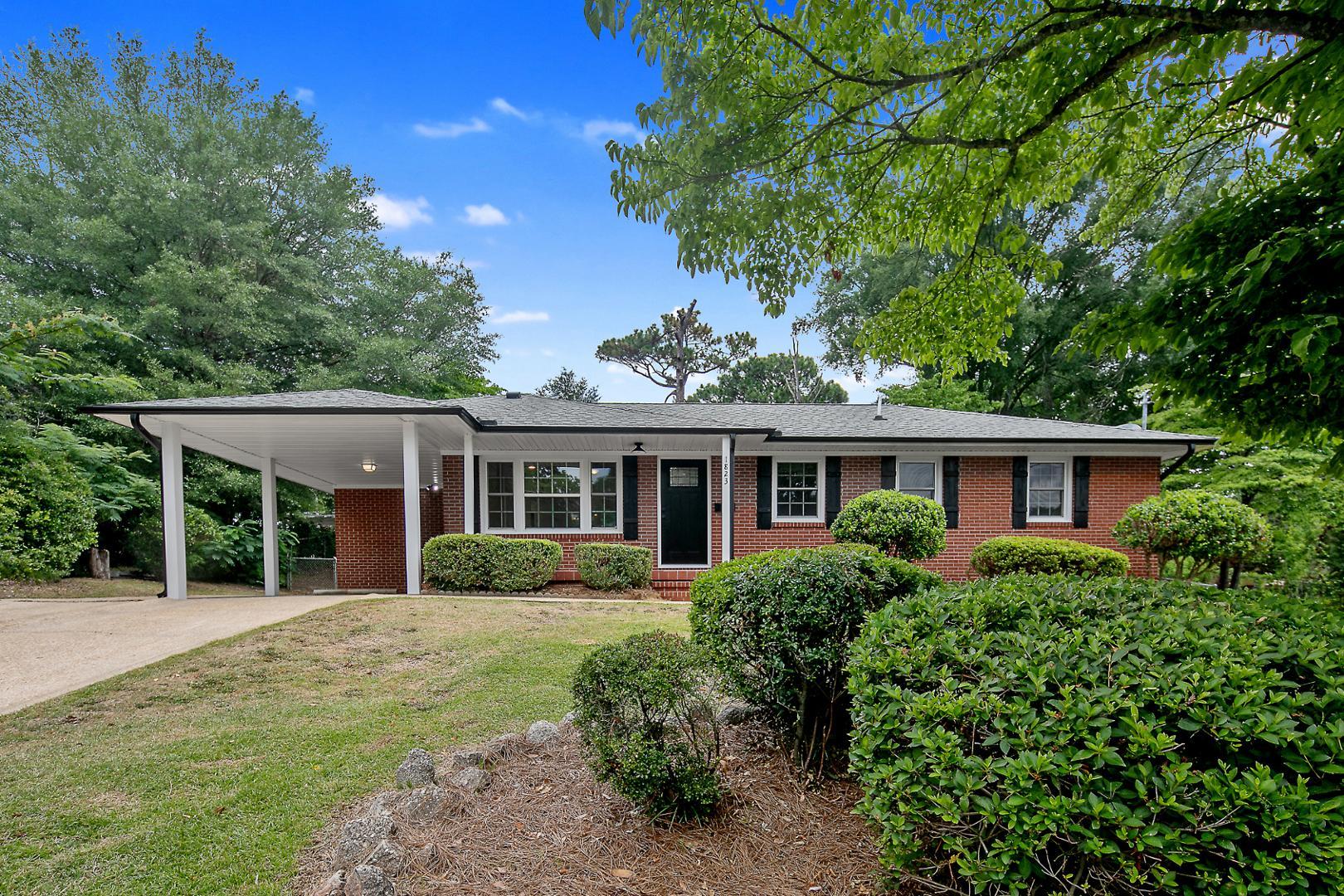 front view of a house with a garden