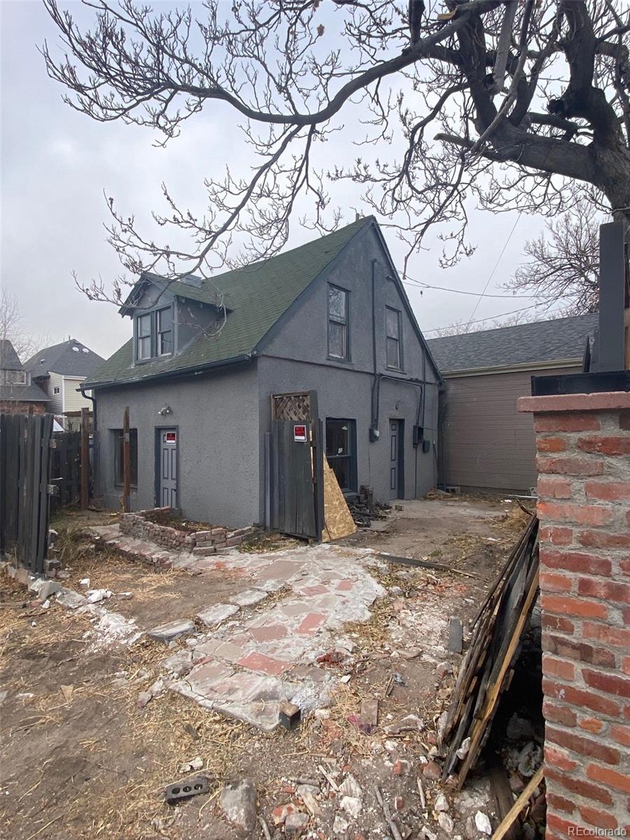 a view of a house with a snow in the yard