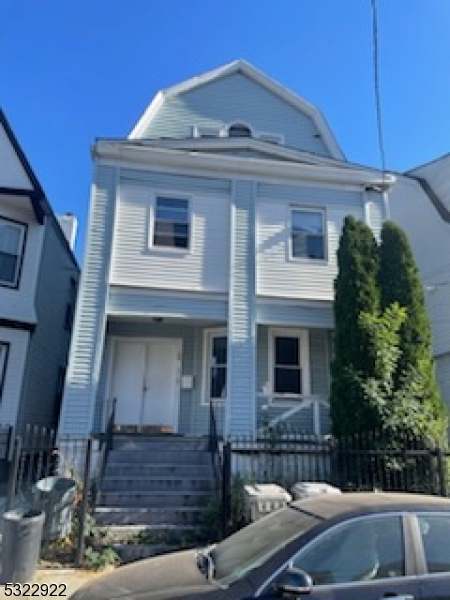 a front view of a house with balcony