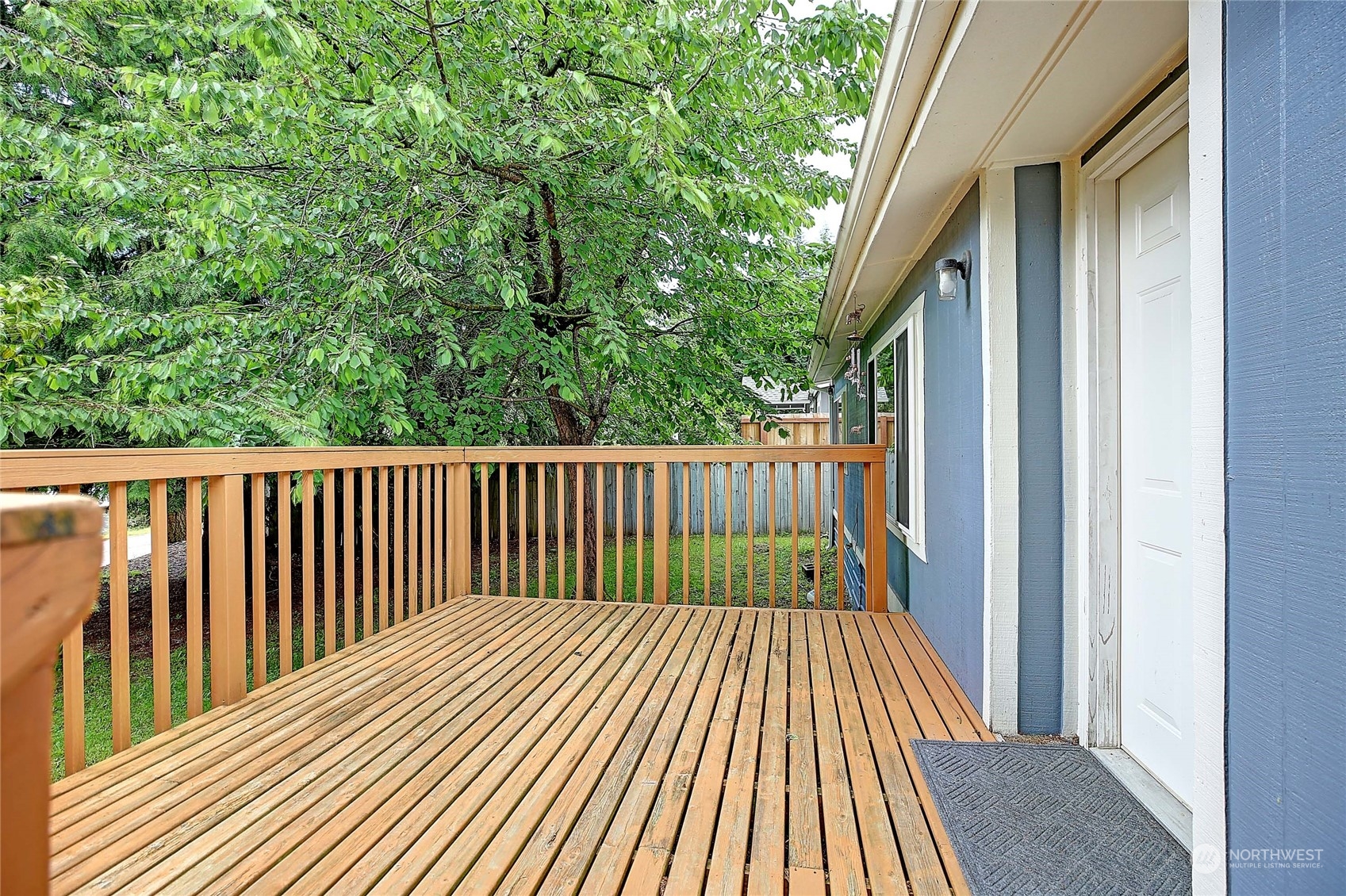 a balcony with trees in front of it