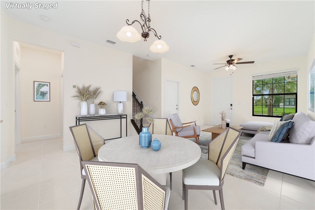 a view of a dining room with furniture window and outside view