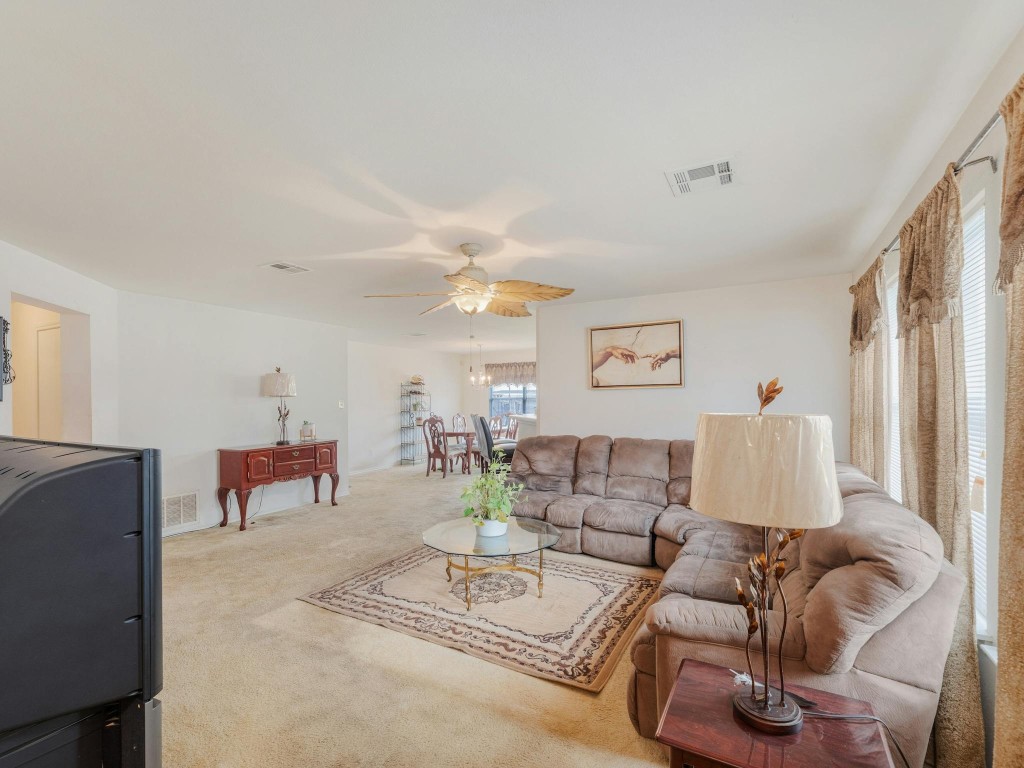 a living room with furniture and a table