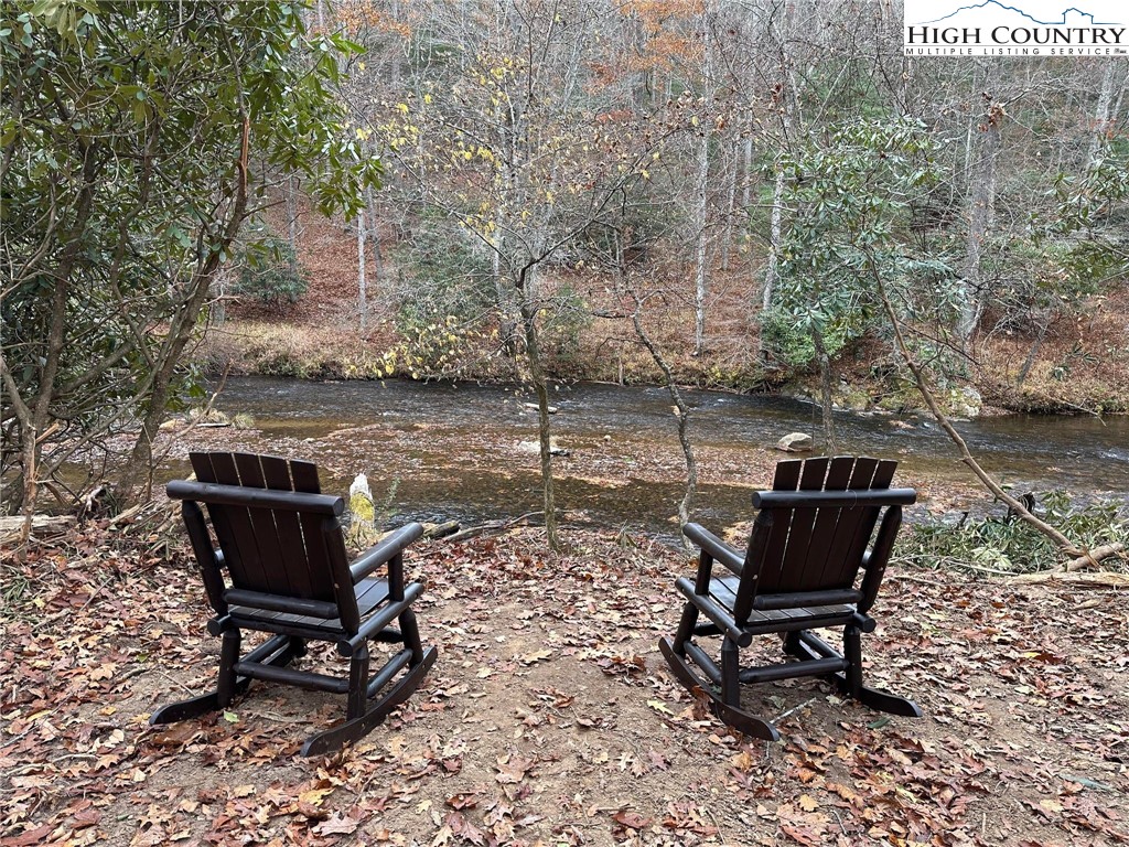 a view of a bench in the backyard