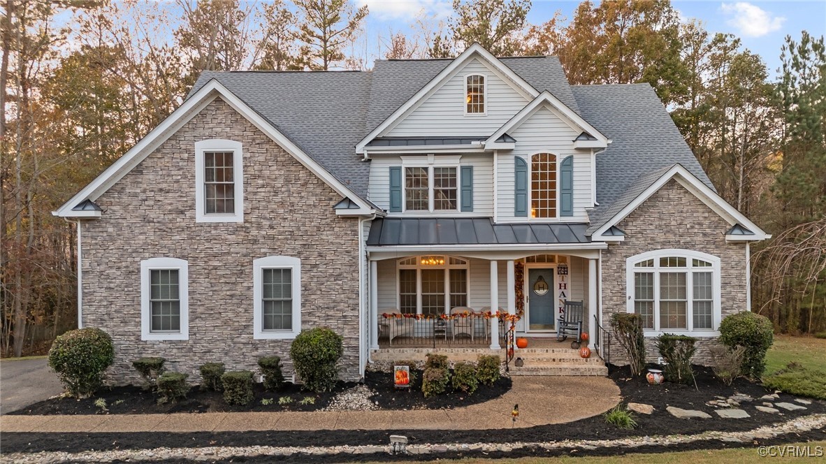 View of front of home with covered porch