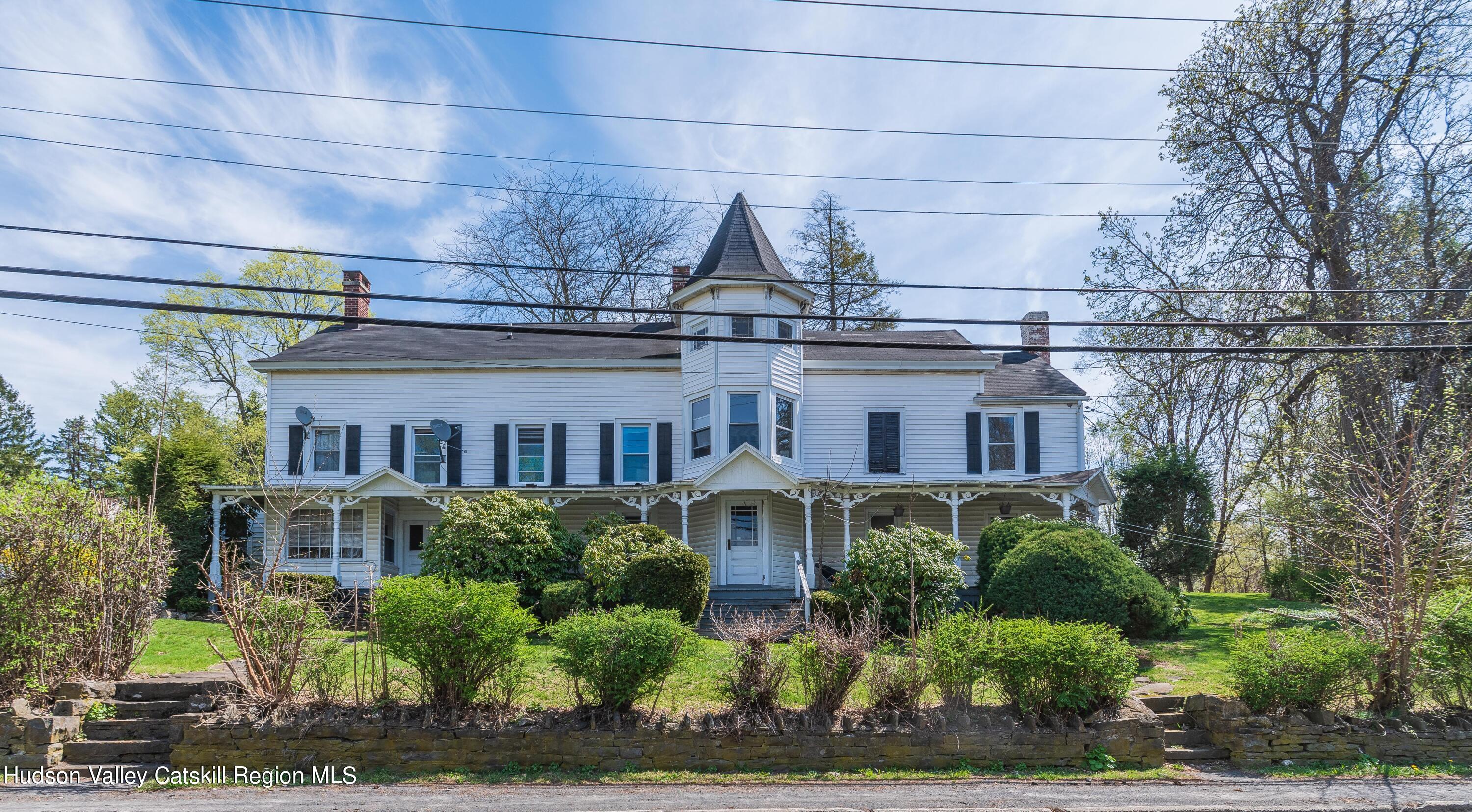 a front view of residential houses with yard