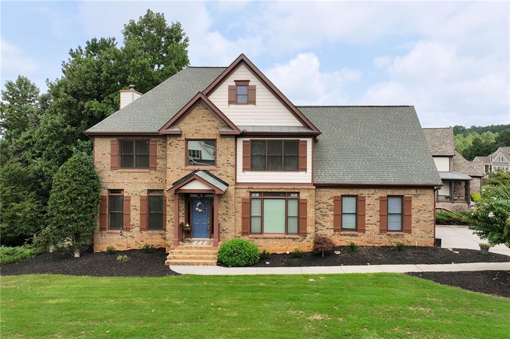 front view of a house with a yard