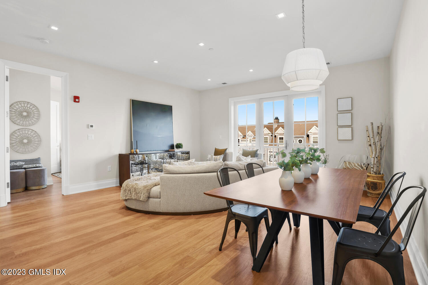 a view of a dining room with furniture and wooden floor