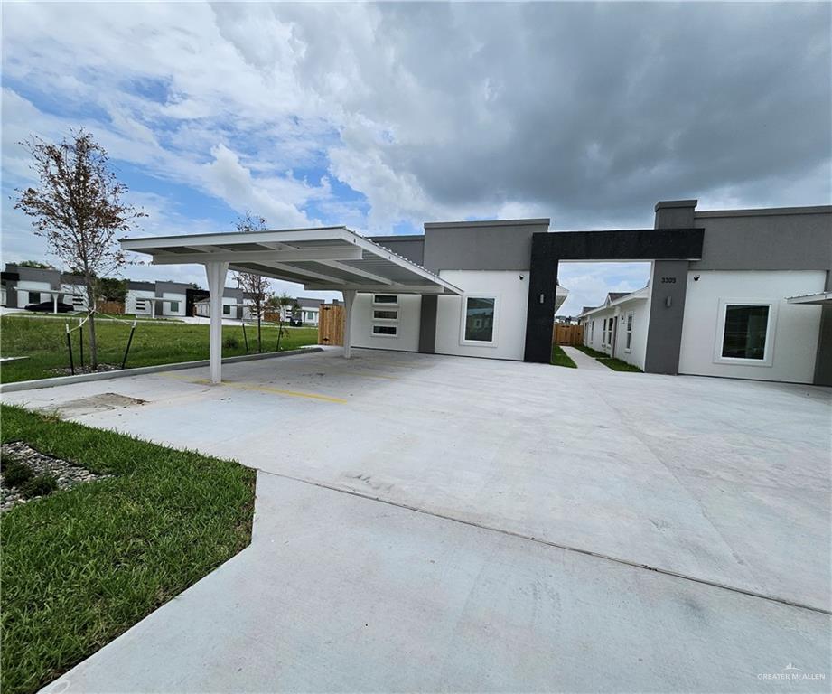 View of front of house featuring a carport