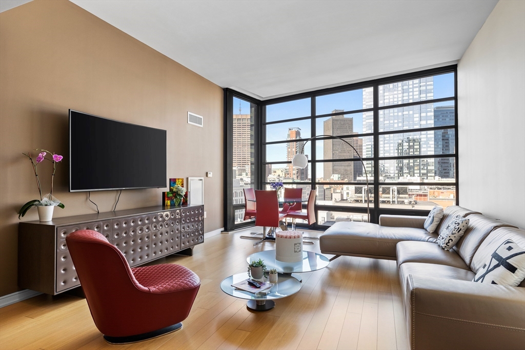 a living room with furniture and a flat screen tv