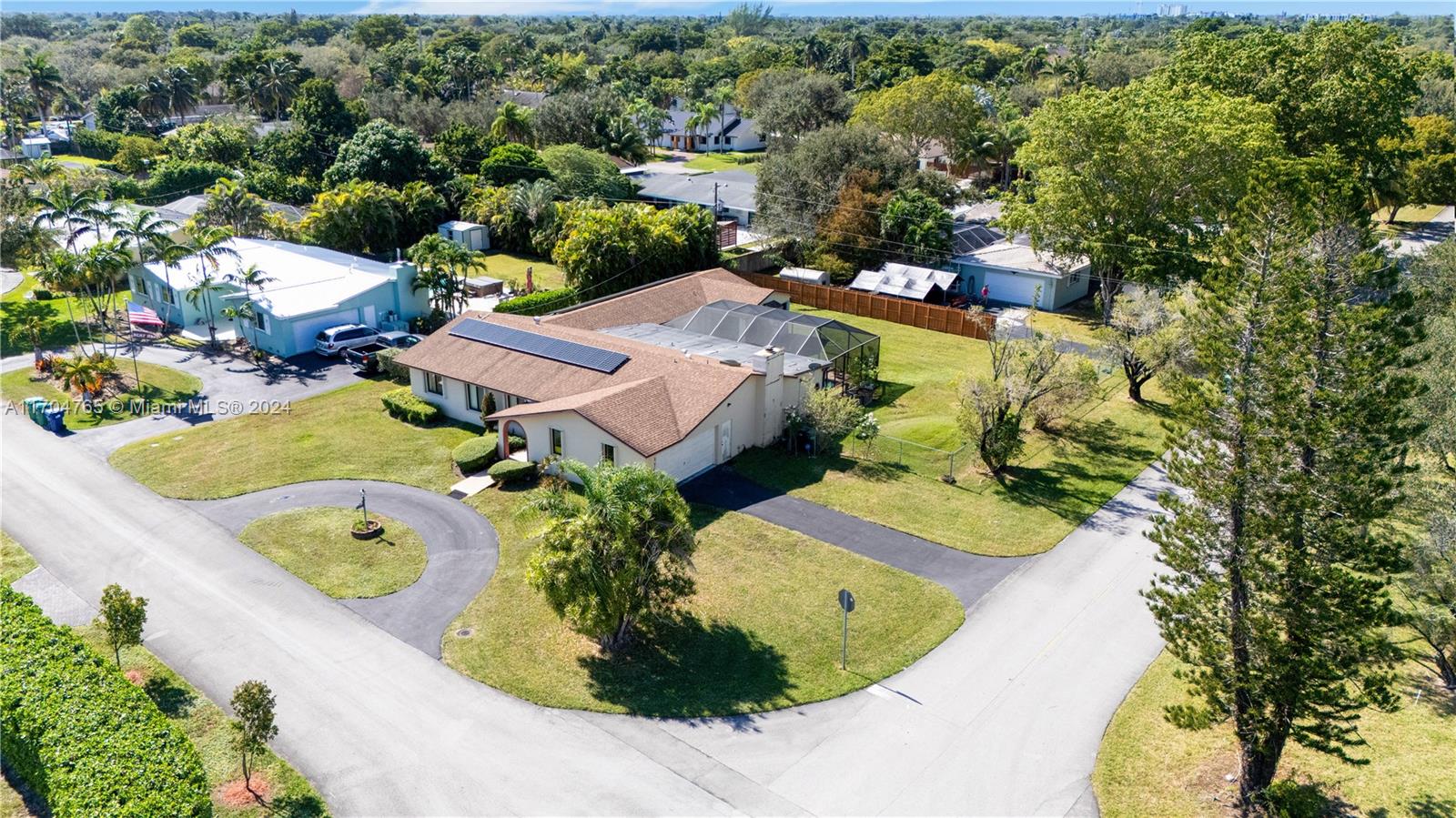 an aerial view of a house with a swimming pool