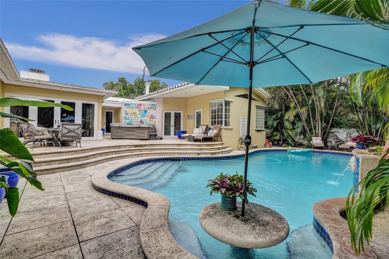 a swimming pool with outdoor seating and yard