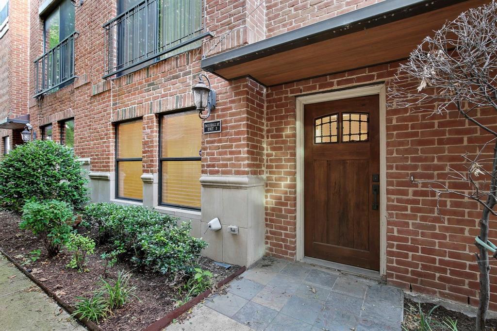 a view of a brick house many windows