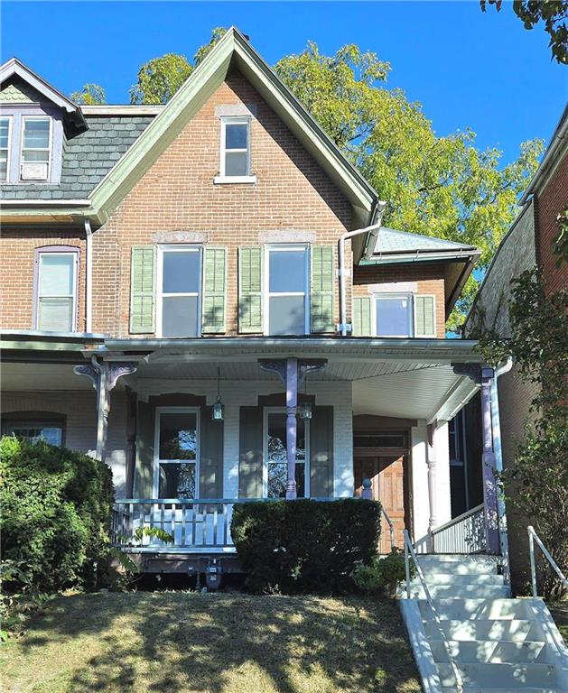 front view of a house with a yard