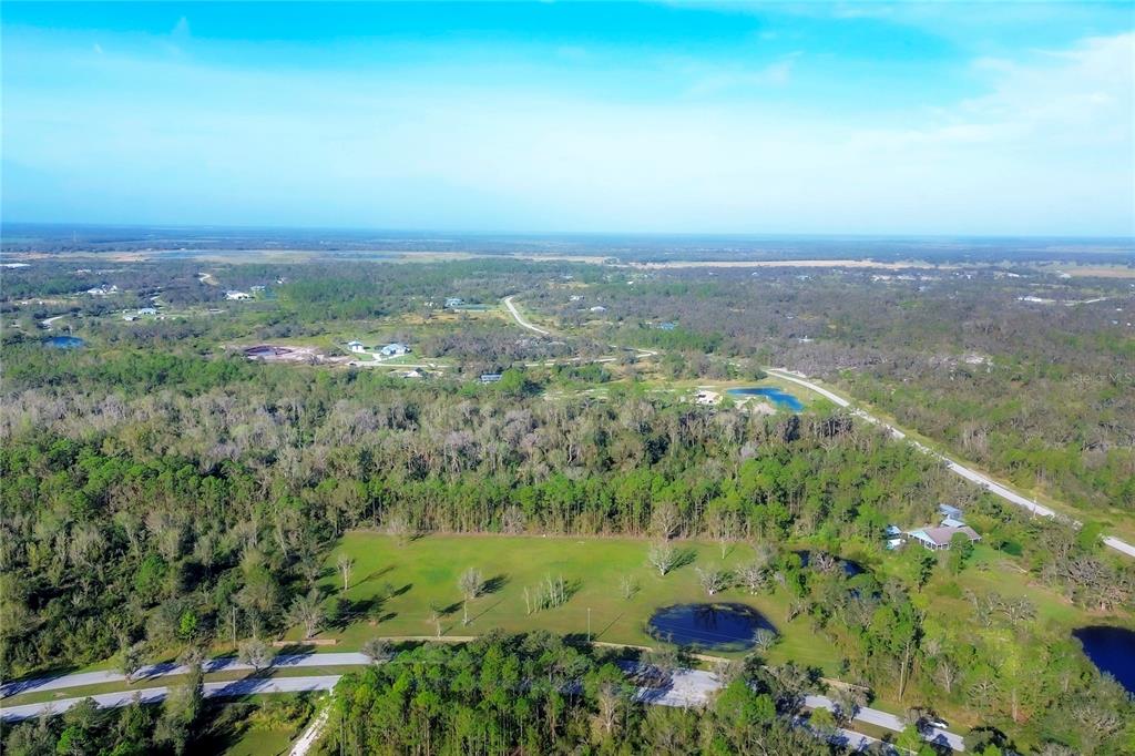 Aerial showing the full lot and surrounding area.