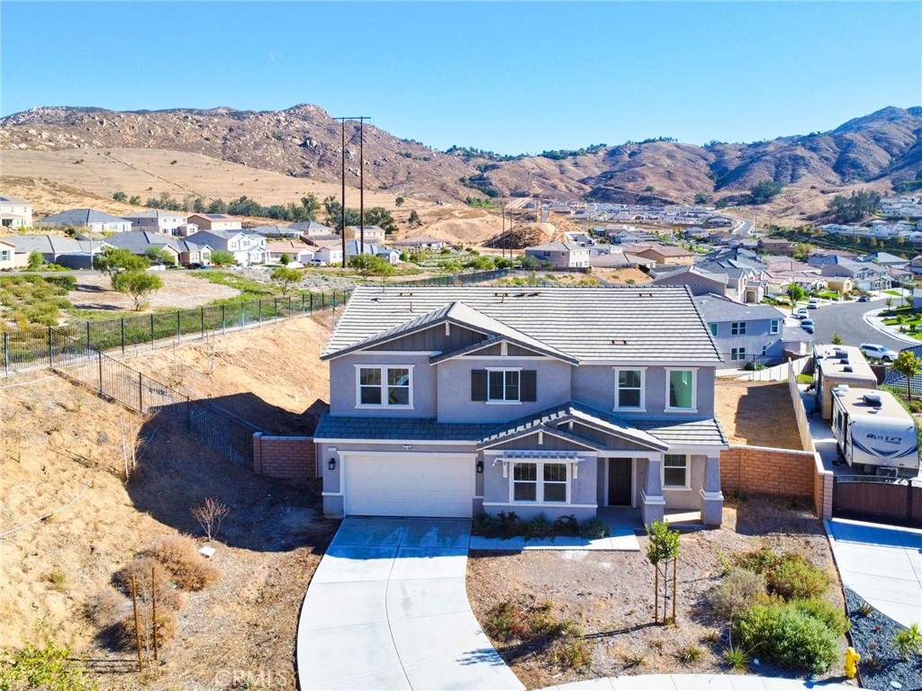 an aerial view of residential houses with outdoor space and river