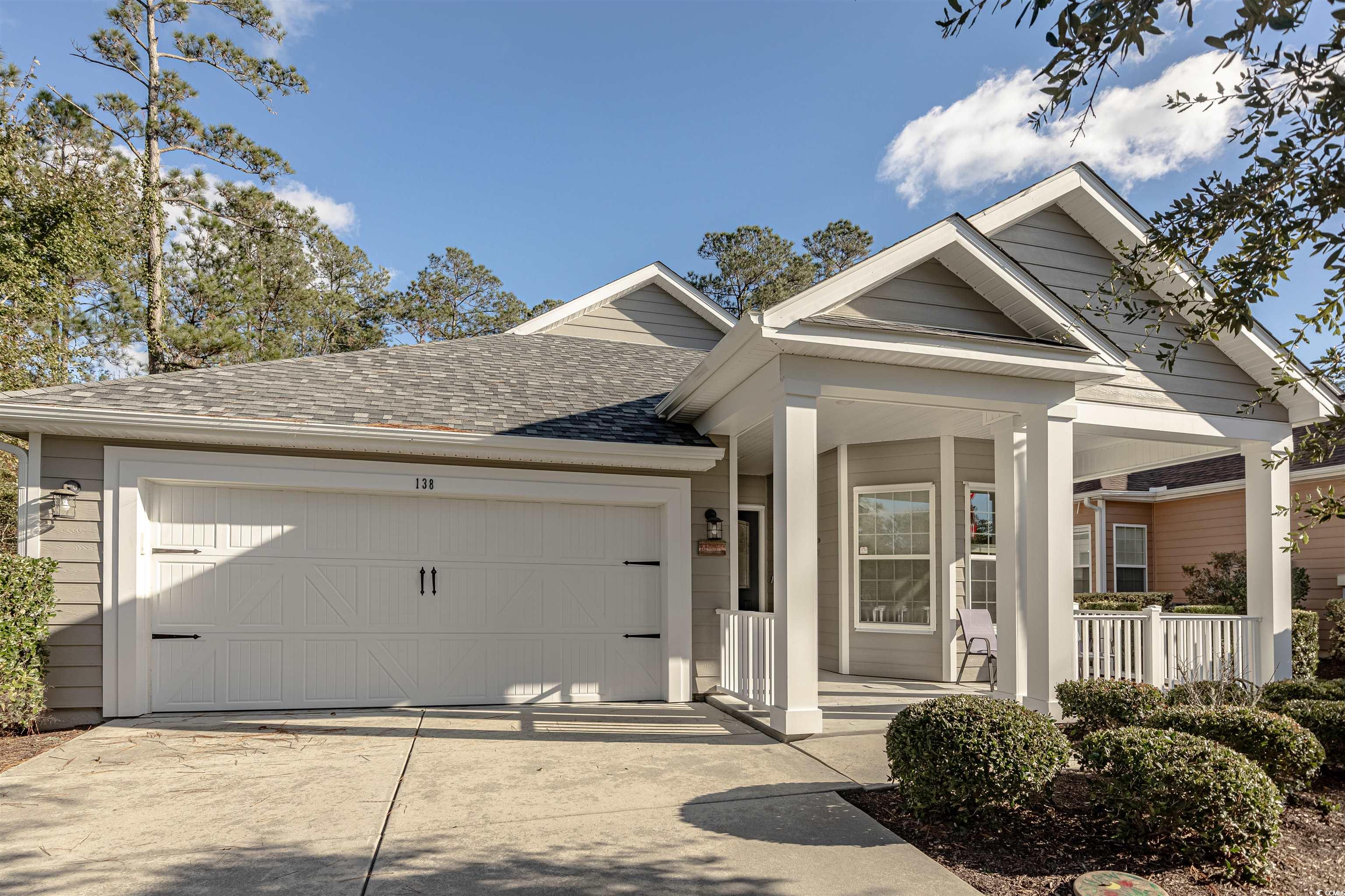 View of front facade featuring covered porch and a