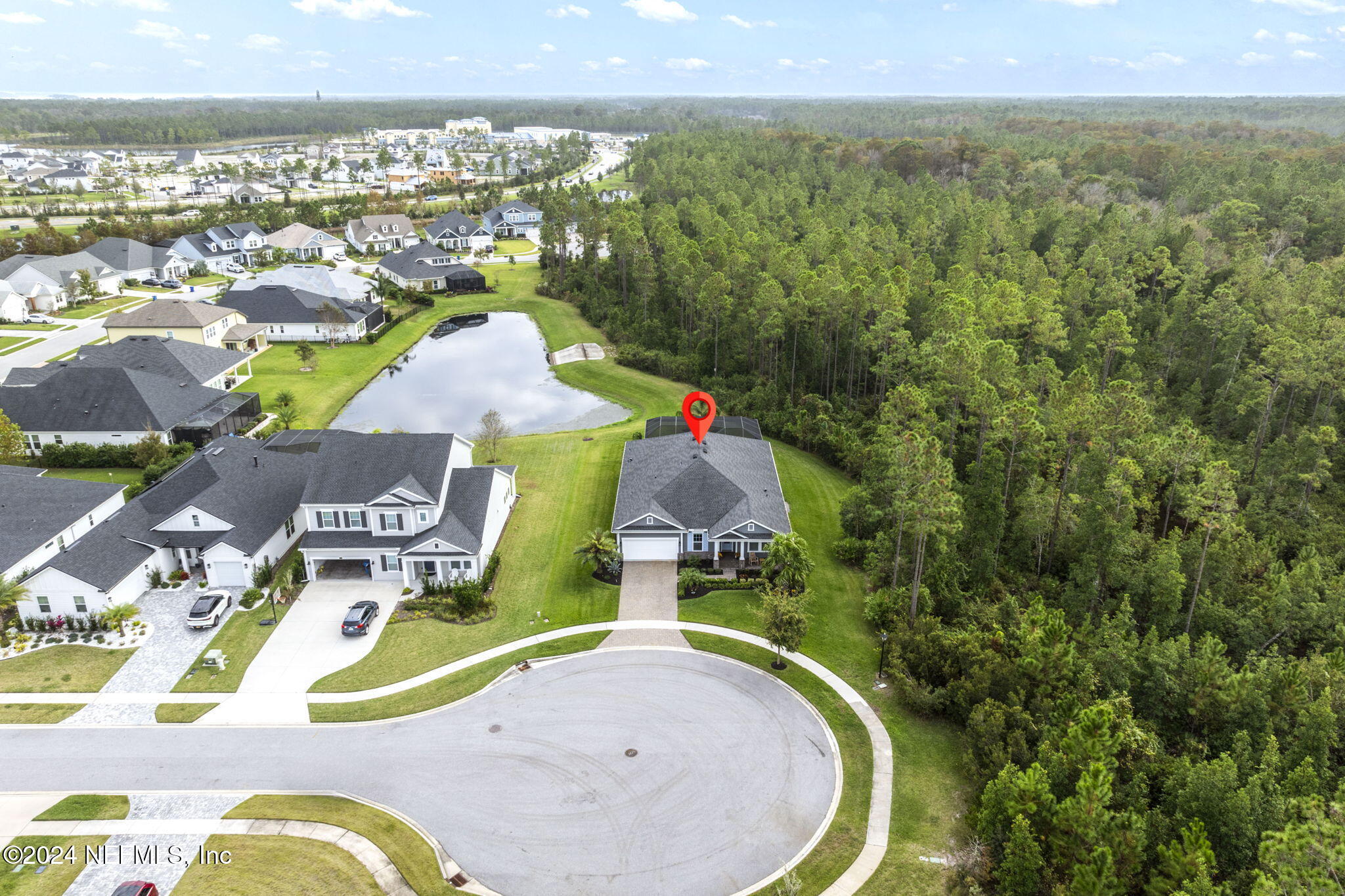 an aerial view of residential house with outdoor space and swimming pool