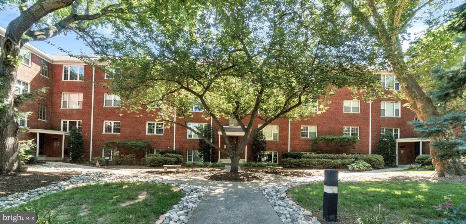 a view of a building with a yard