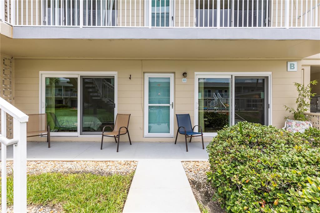 a house view with a seating space and garden