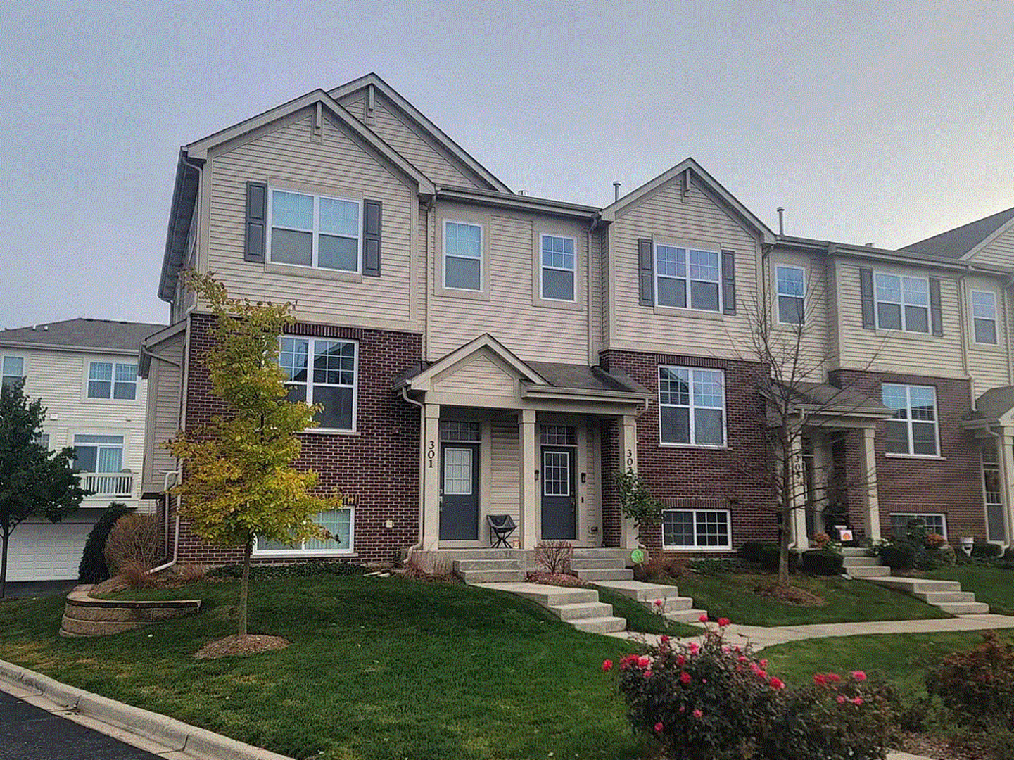 a front view of a house with a yard