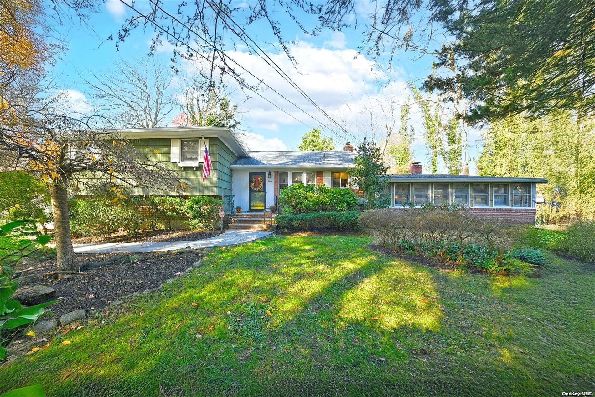 a view of house with a yard