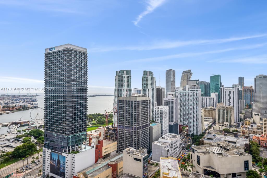 a view of city with tall buildings