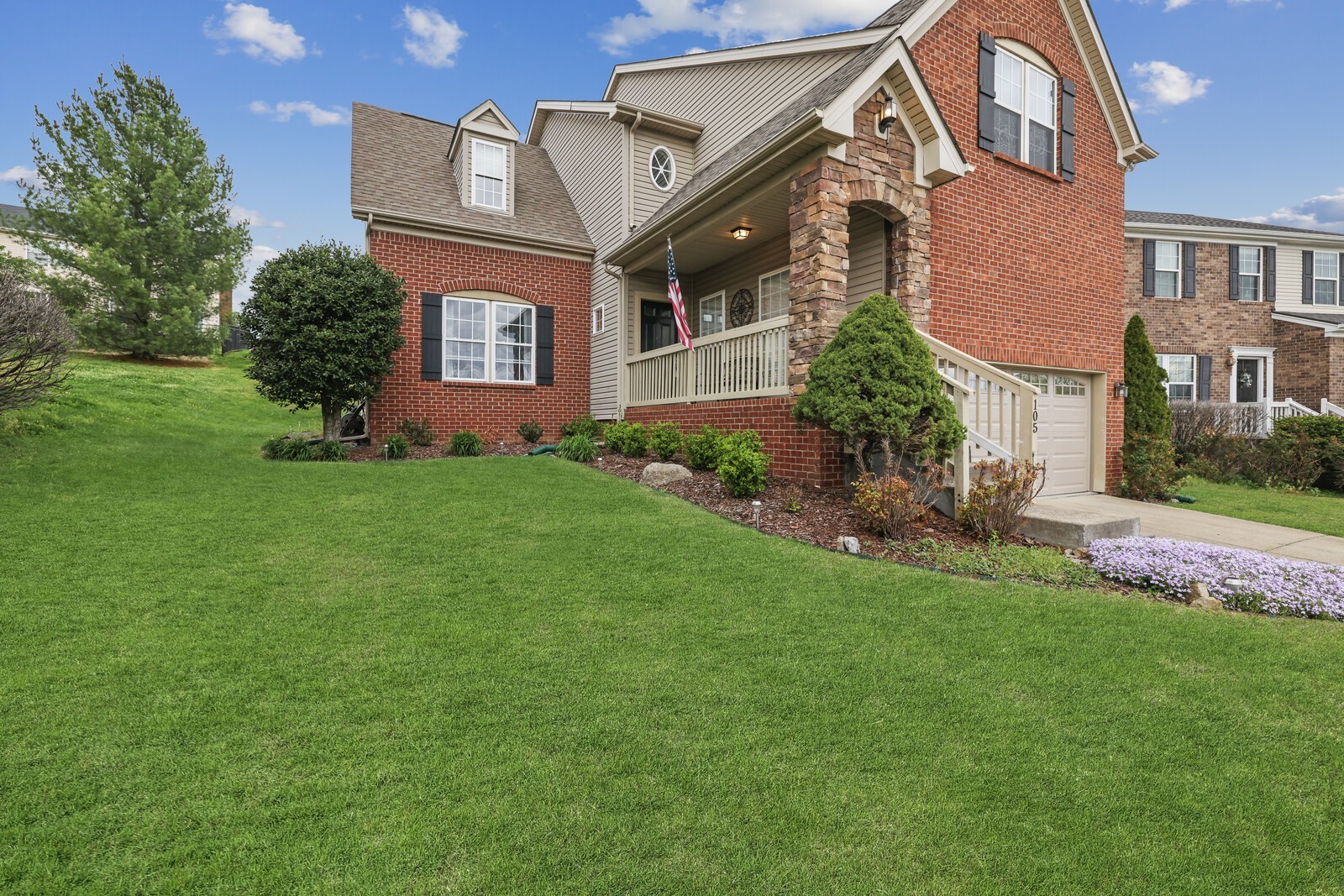 front view of a house with a yard