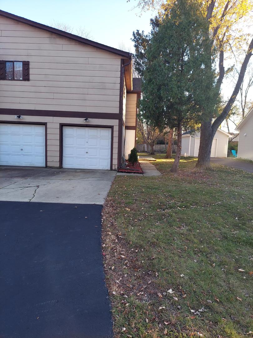 a front view of a house with yard