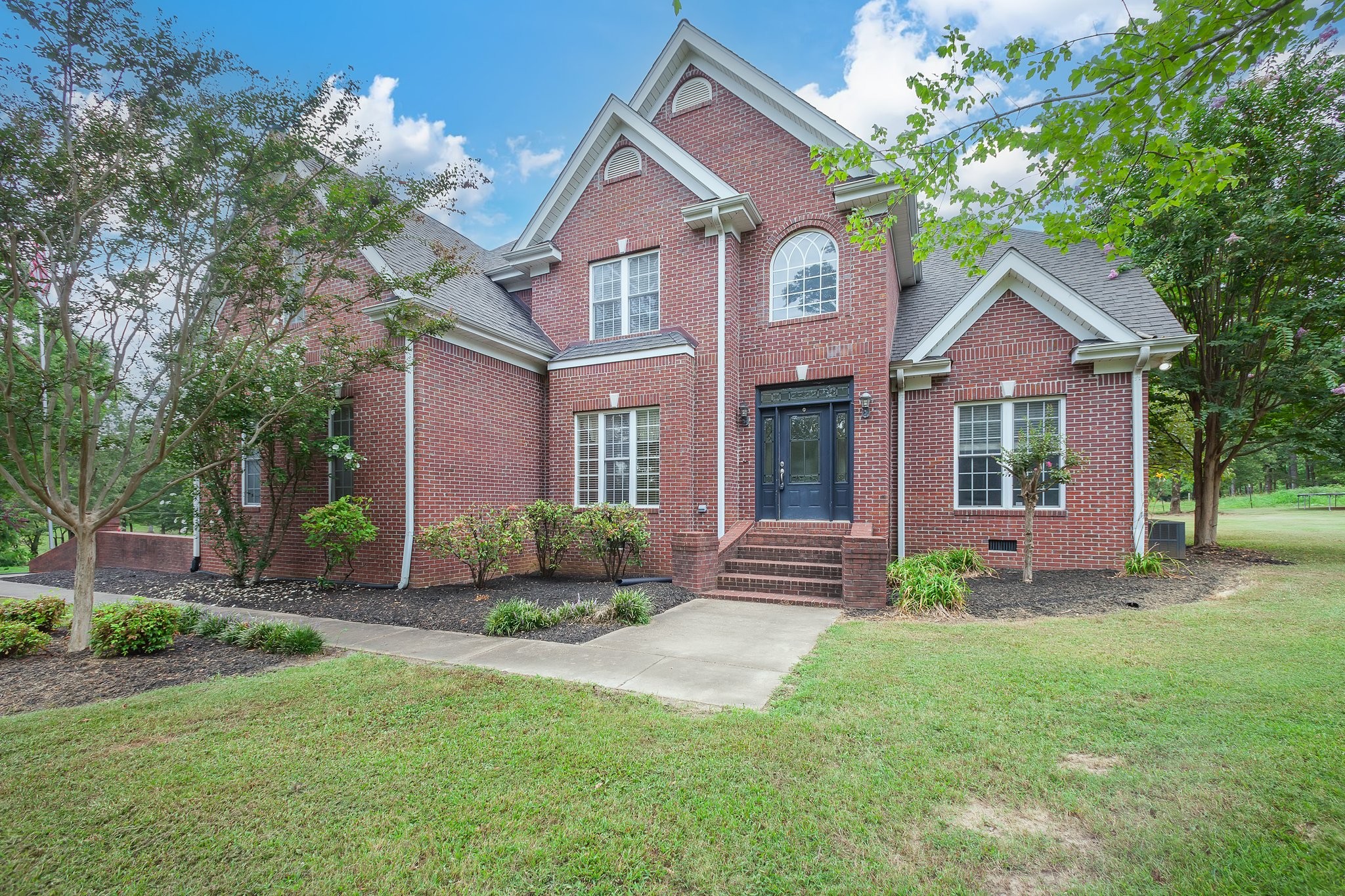 front view of a house with a yard