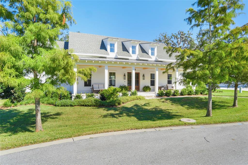 a front view of house with yard and green space